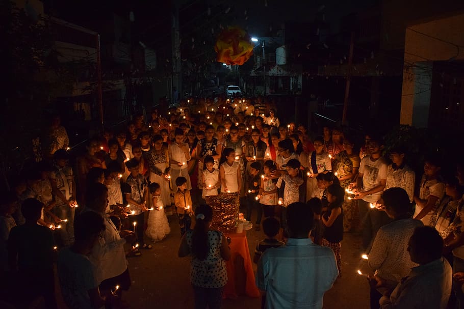 group of people holding candles while huddling, light, crowd