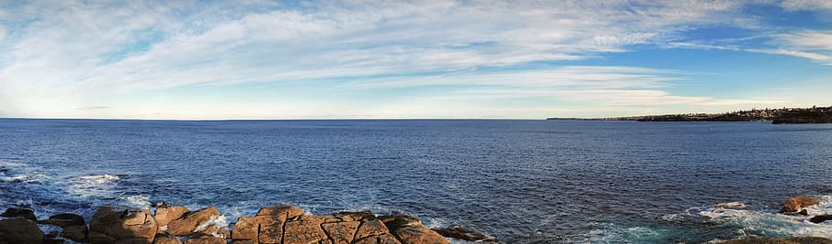 rocky hill viewing calm sea under blue skied at day time, panorama HD wallpaper