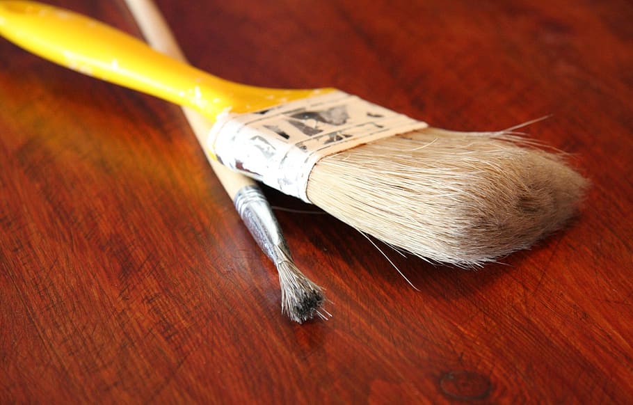 selective focus photography of two yellow paint brushes, surface HD wallpaper