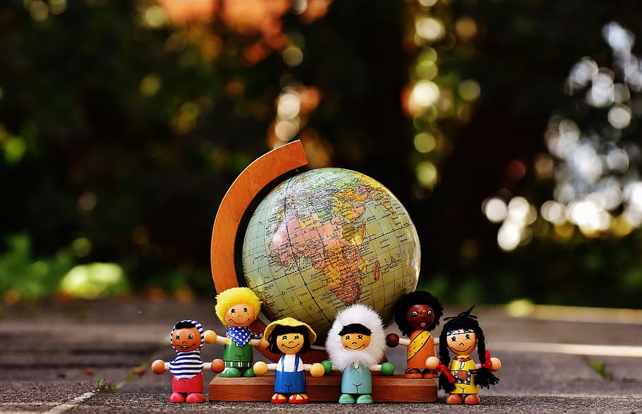 group of people character plastic toys standing on brown and blue desk globe photo, HD wallpaper