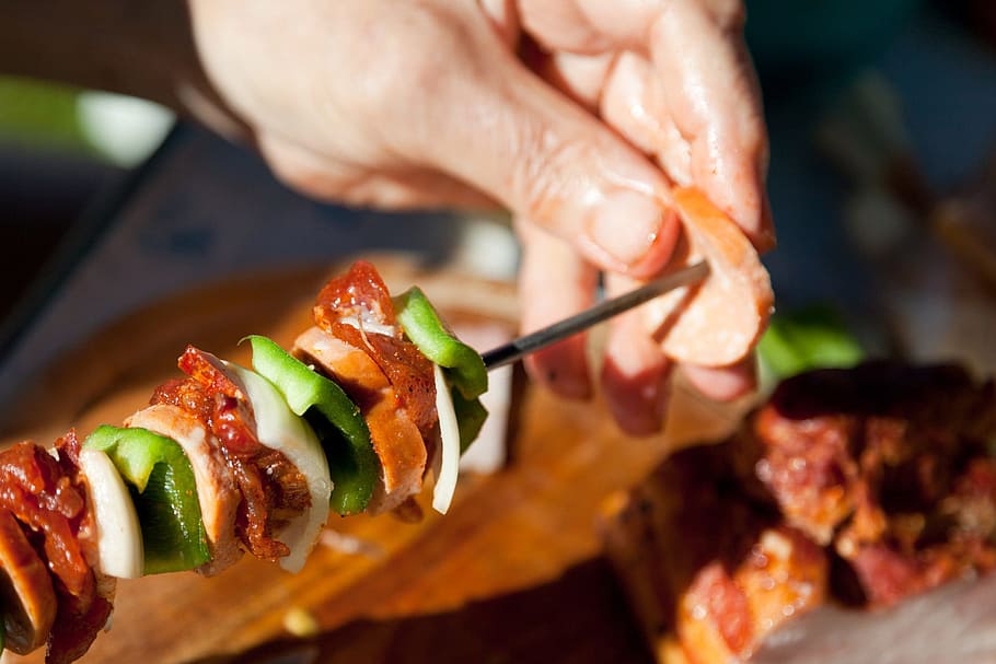 person making skewered food, barbecue, bbq, beef, chicken, preparing HD wallpaper