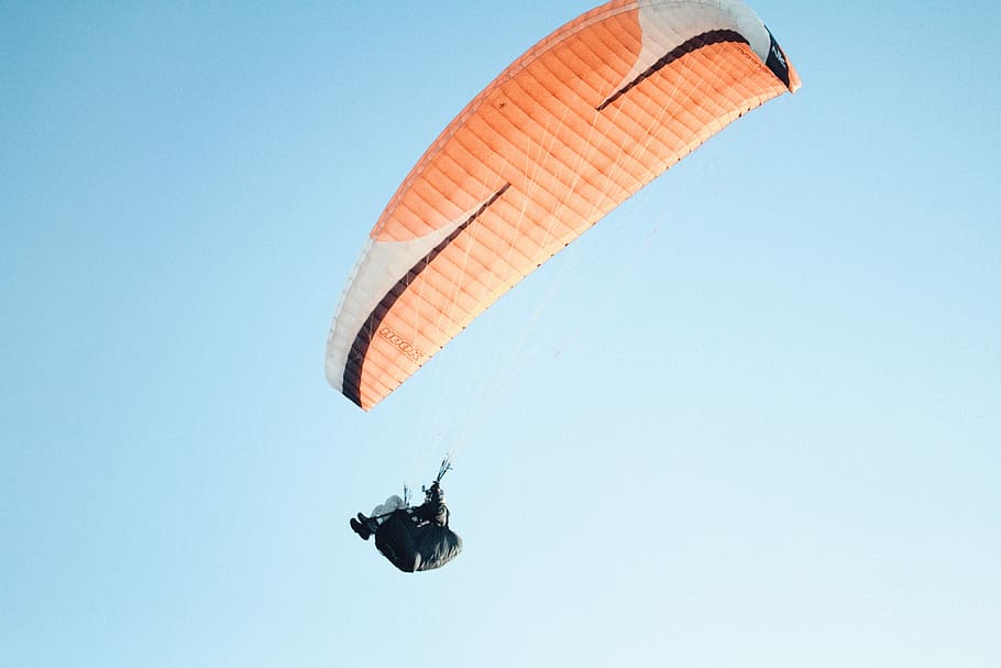 man wearing parachute in sky during daytime, person sailing on parachute HD wallpaper