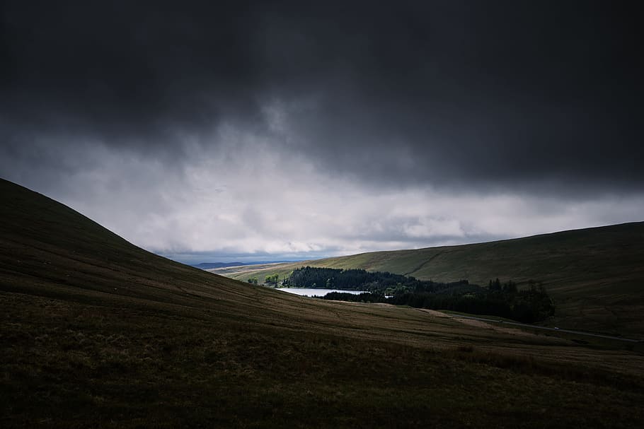 brown mountain under cumulos clouds, field and pond under cloudy sky HD wallpaper
