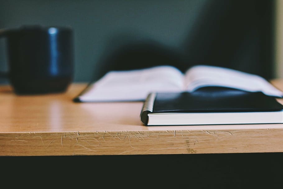 black hardbound book on brown wooden table, journal, desk, education HD wallpaper