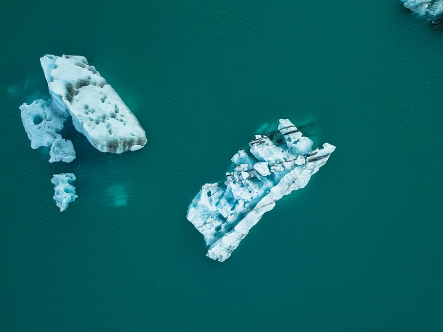 body of water with iceberg at daytime, two white ice formation on body of water HD wallpaper