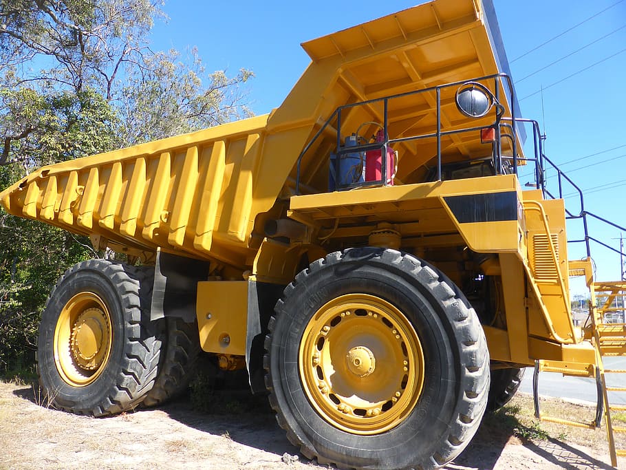 yellow earth mover parked near tree, truck, vehicle, transportation