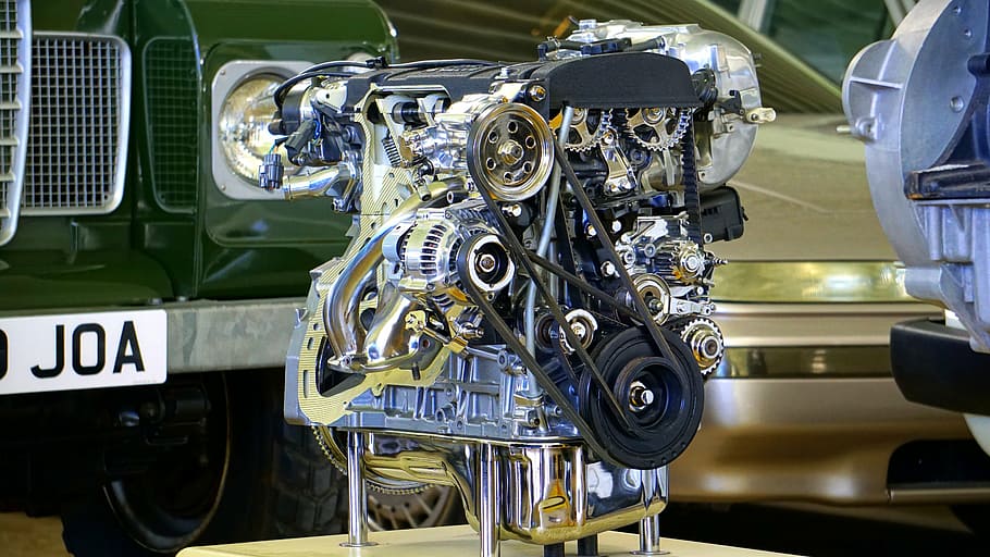 silver vehicle engine beside green vehicle, car, car engine, motor, HD wallpaper
