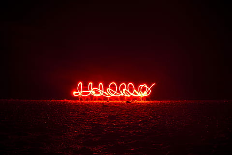 red light near ocean during night time, red LED strip above brown soil HD wallpaper