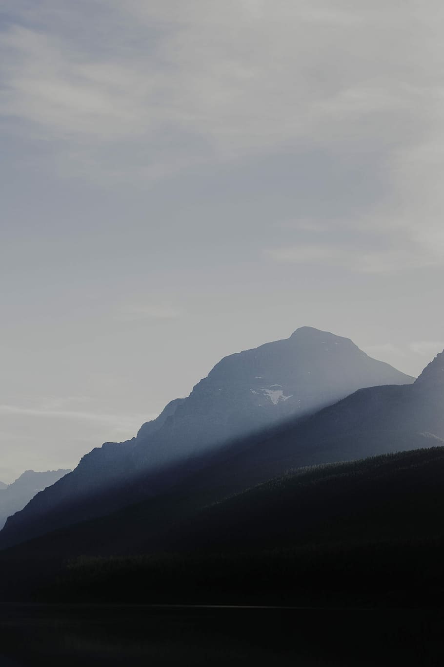 silhouette photography of mountain, mountain under white cloudy sky at daytime HD wallpaper