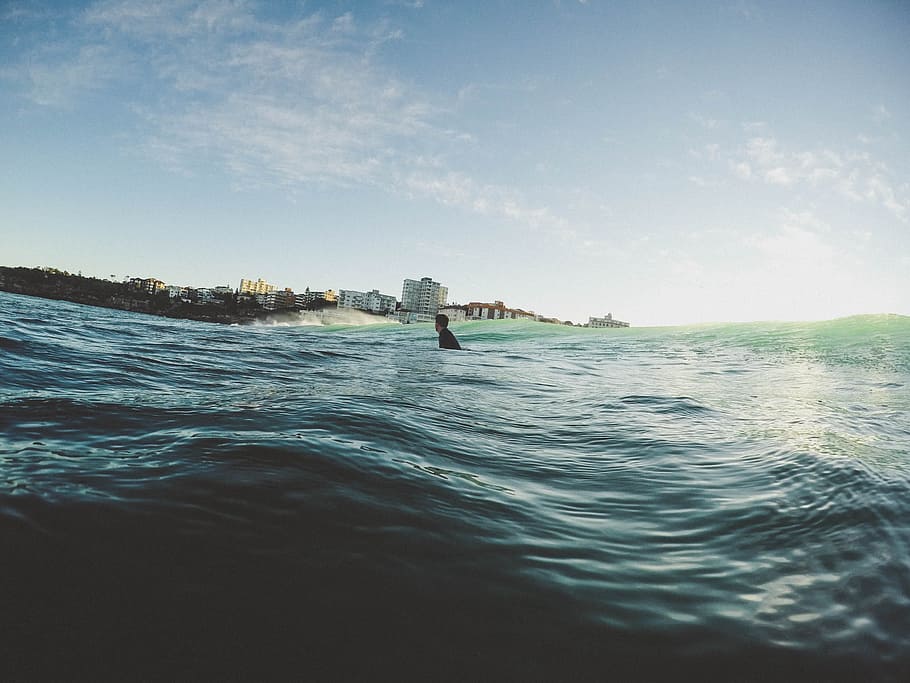man on body of water during daytime, person swimming on the ocean HD wallpaper