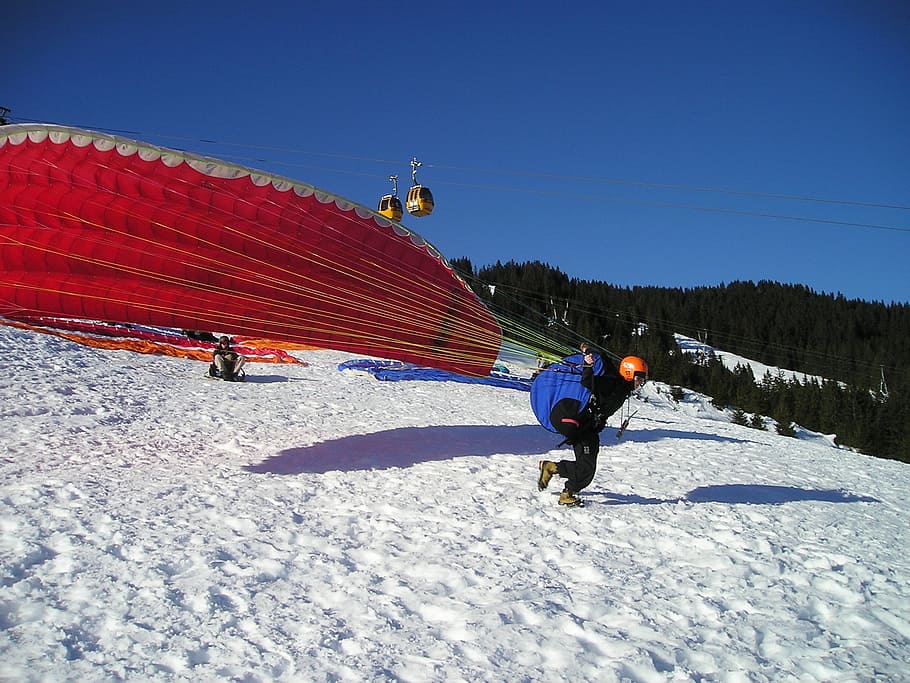paragliding, start, elevator phase, pull up, take off, winter HD wallpaper