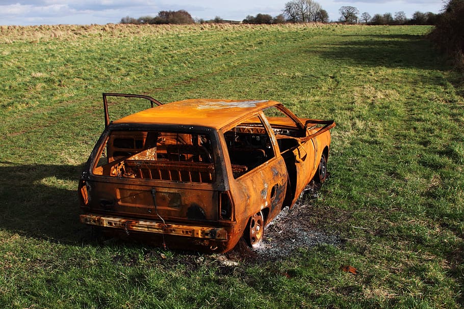 orange vehicle on green grass field at daytime, burned, accident HD wallpaper