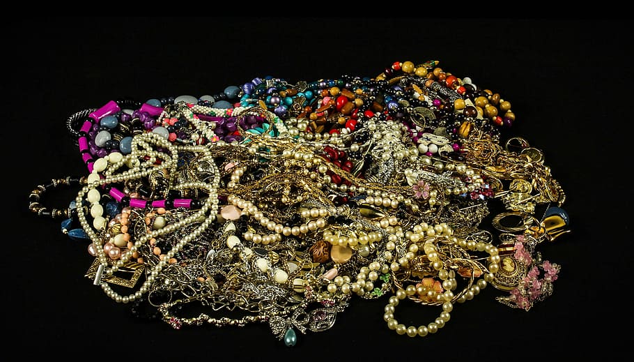 pile of assorted jewelry, treasure, pearls, beads, gems, gold