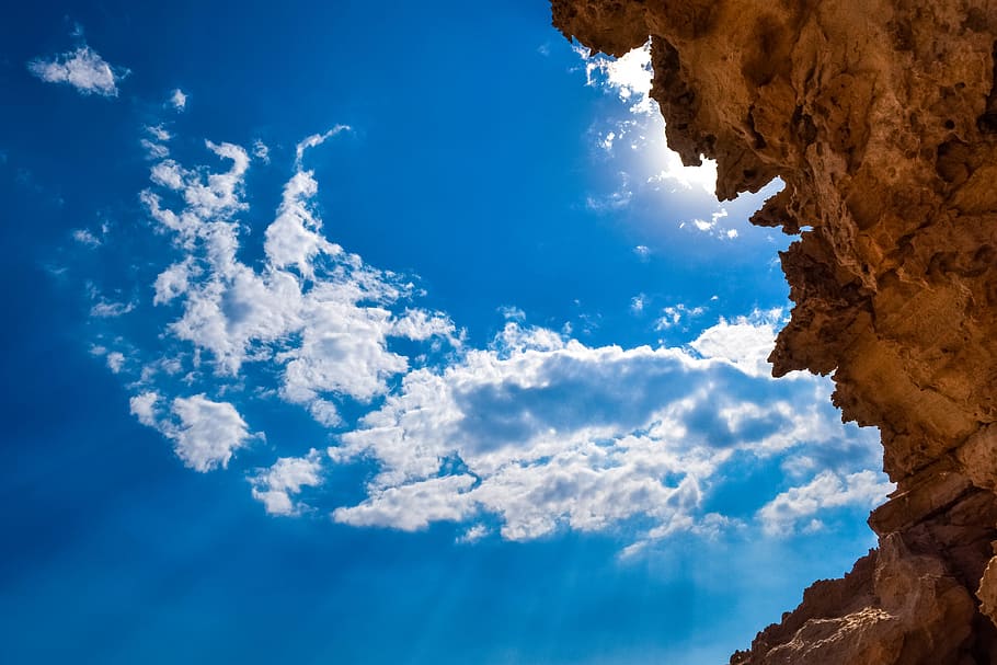 rock, cliff, sky, clouds, light, sunbeam, sunlight, nature HD wallpaper