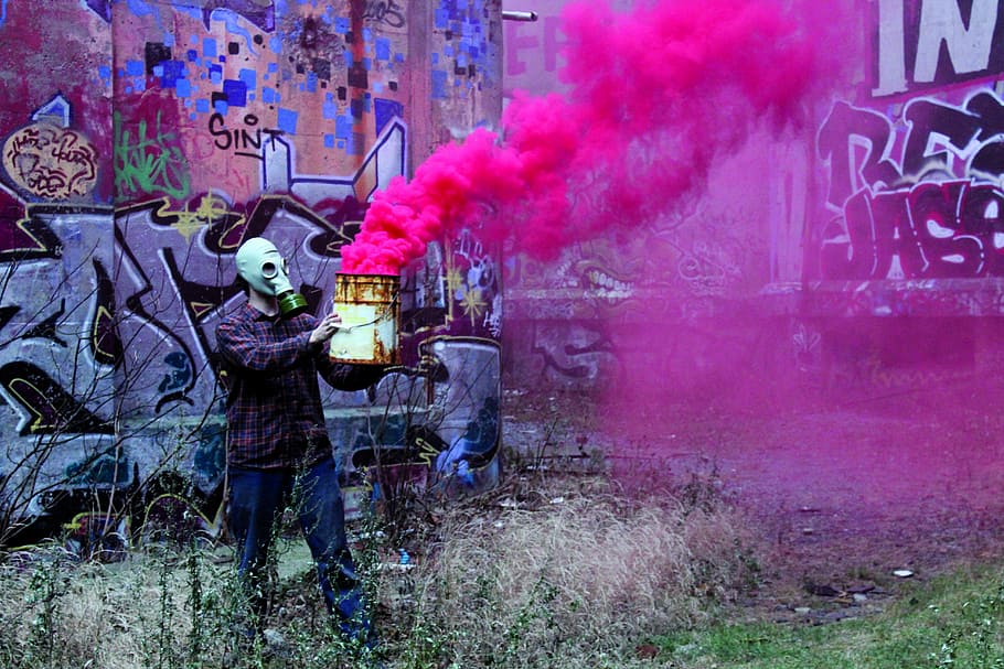 Fluorescent, man wearing gas mask holding can with pink smoke HD wallpaper
