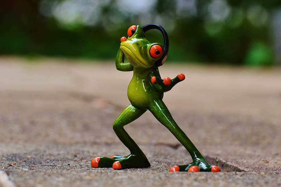 selective focus photography of red and green frog wearing headset figurine on brown surface, HD wallpaper
