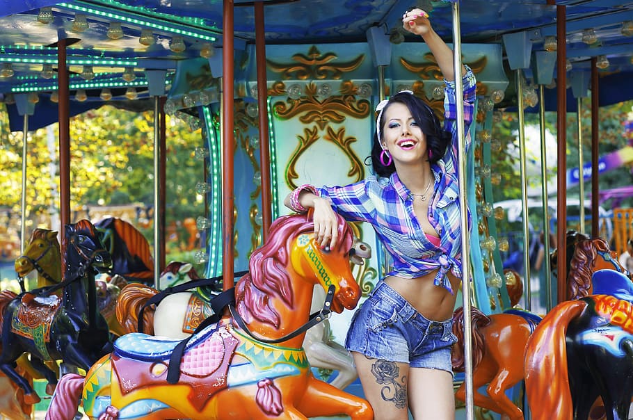 woman in purple plaid long-sleeved button-up shirt on carousel HD wallpaper