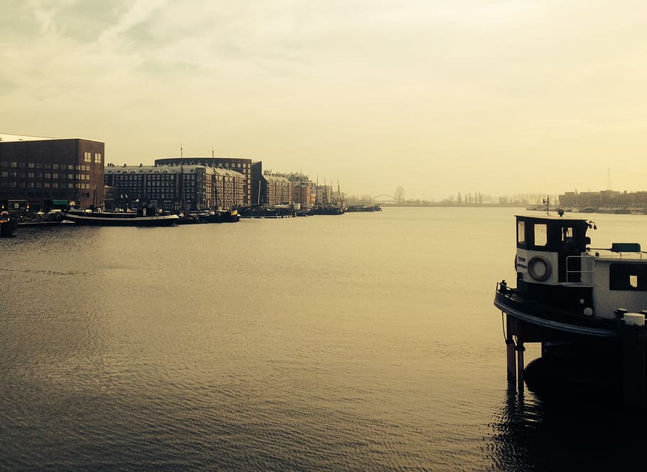 sepia photo of dock and buildings, boat near dock, high rise building HD wallpaper