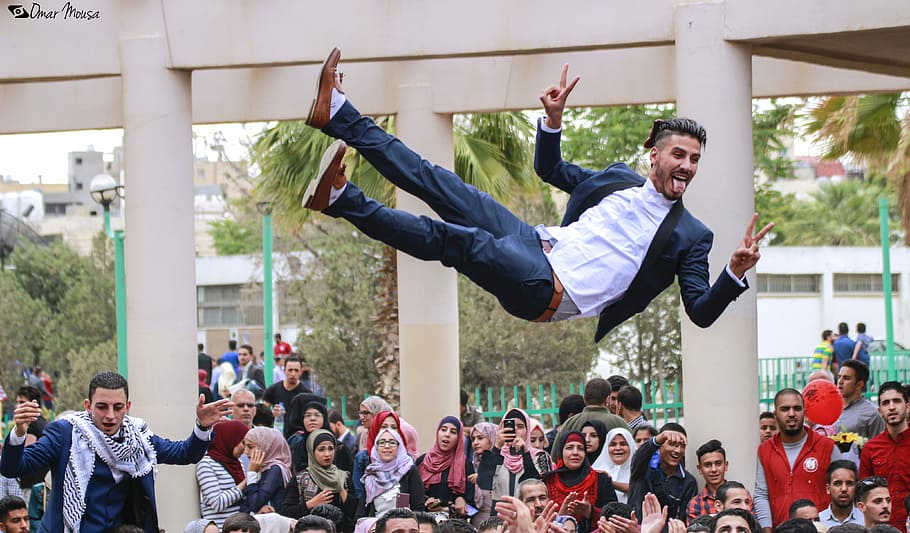 man levitating in midair, flying man, graduation, university, HD wallpaper