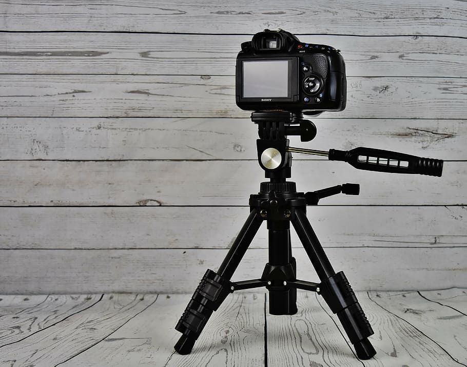 black camera with tripod stand near wall, sony slt-a58, digital camera HD wallpaper