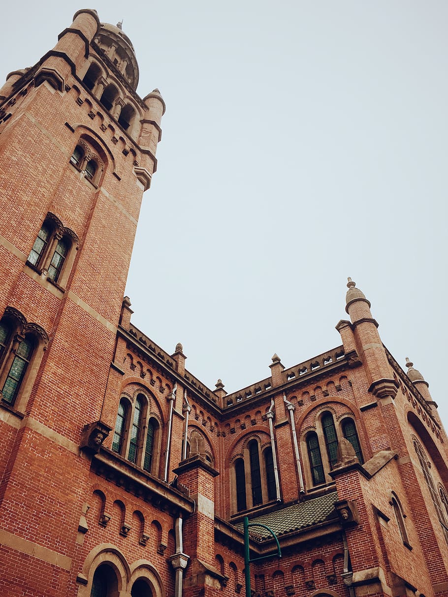 red concrete building low-angle photography, long angle photography of brown castle HD wallpaper