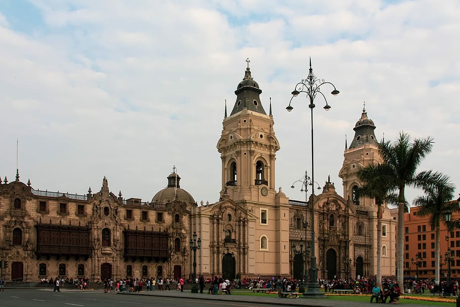 beige concrete building under white clouds, historic centre HD wallpaper