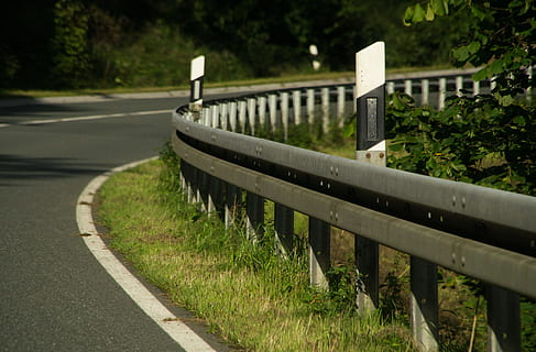 curve road near barriers and trees, guard rail, delineator posts HD wallpaper