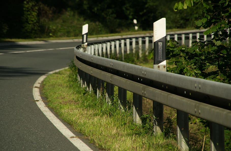 curve road near barriers and trees, guard rail, delineator posts HD wallpaper