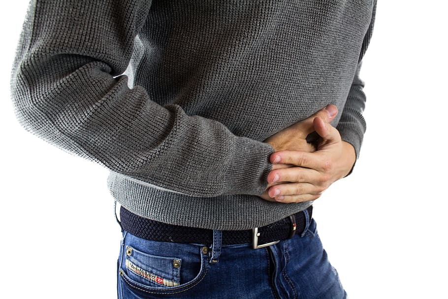 men's gray sweater and blue denim bottoms, abdominal pain, appendicitis