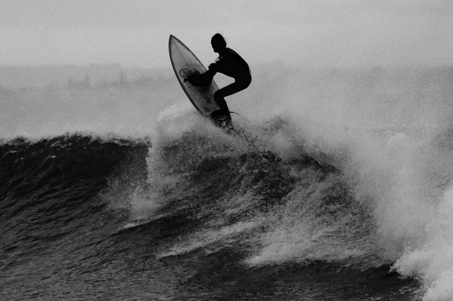 grayscale photo of man riding surfboard, surfer, surfing, wave HD wallpaper