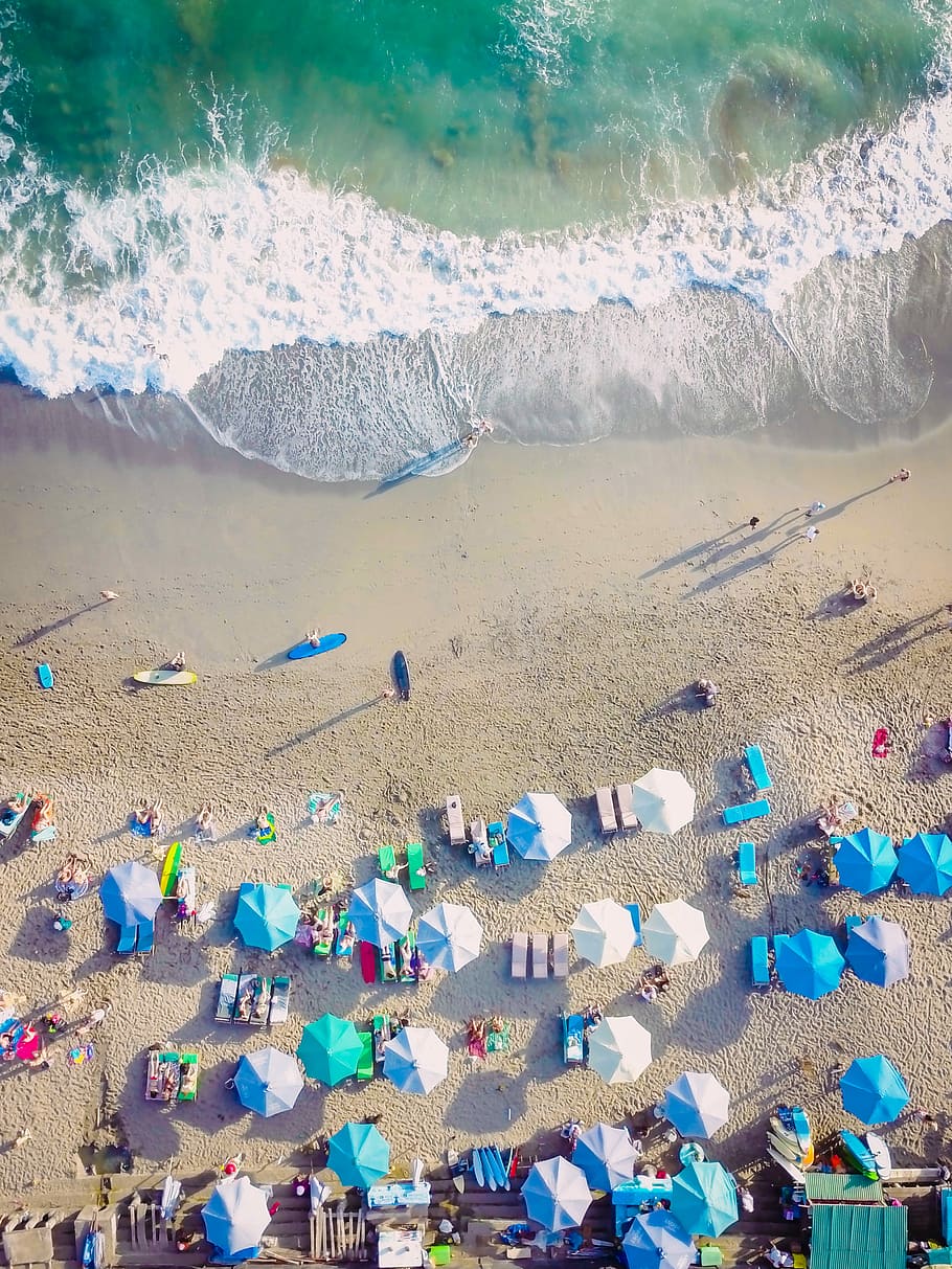bird's eye view photo group of people lying on sea shore, people near seashore during daytime HD wallpaper