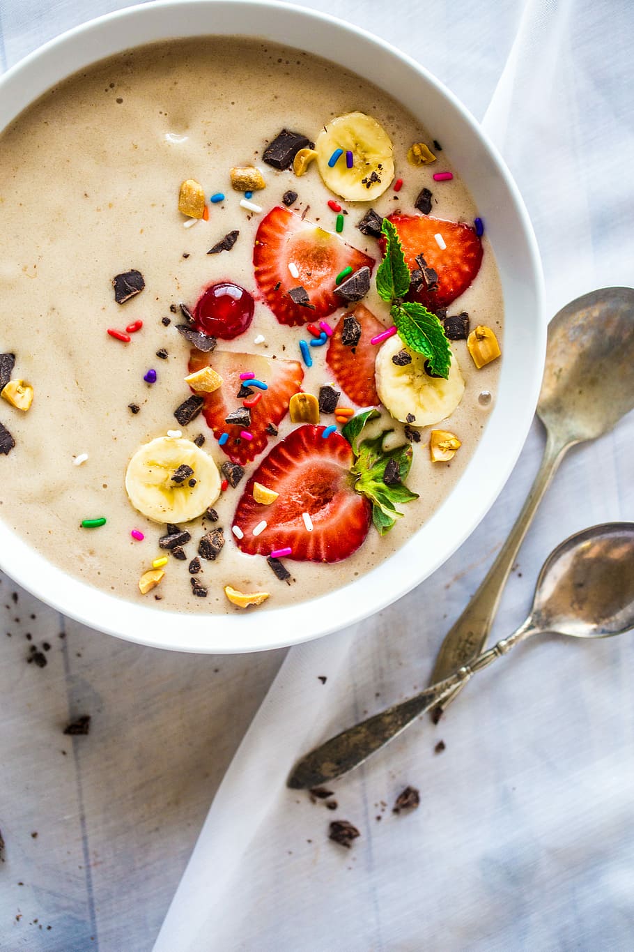 stainless steel spoons, fruit salad in bowl beside two spoons HD wallpaper
