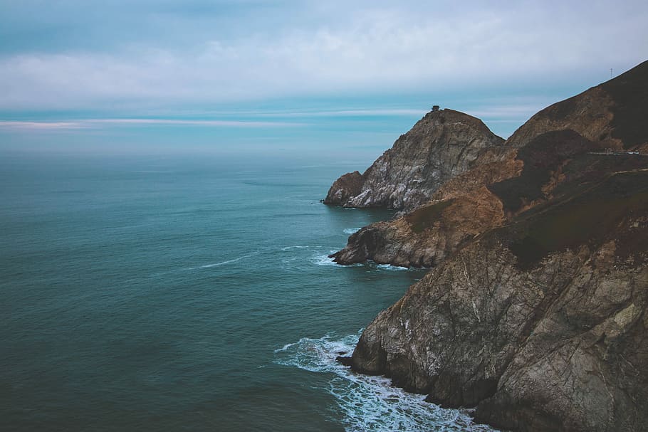 mountain photography, body of water, rock, cliff, sea, ocean HD wallpaper
