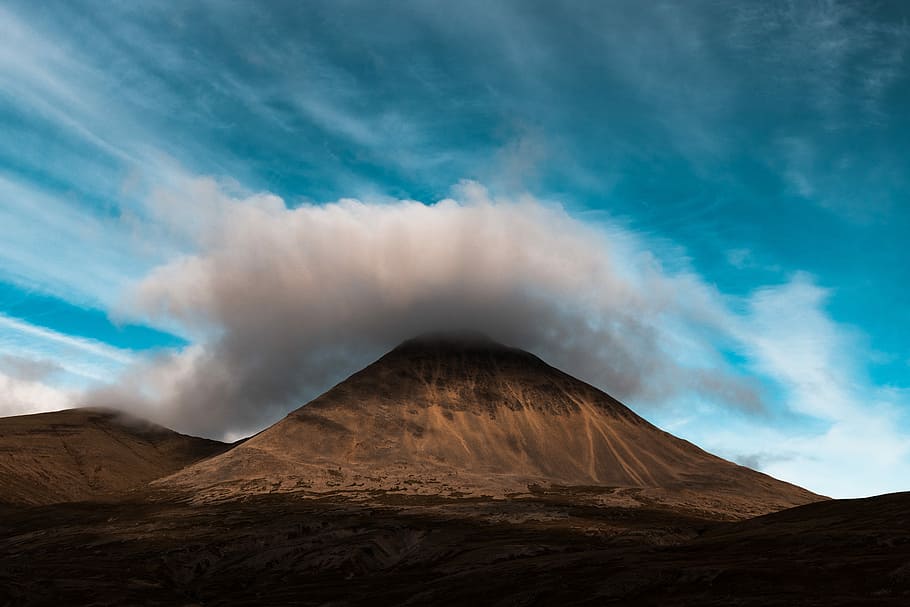 pyramid mountain covered with clouds, brown mountain under gray clouds HD wallpaper