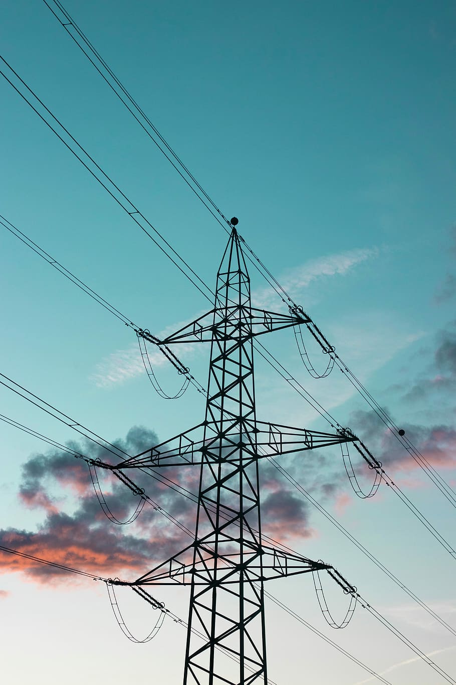 photo of black transmission tower, electric tower low-angle photography