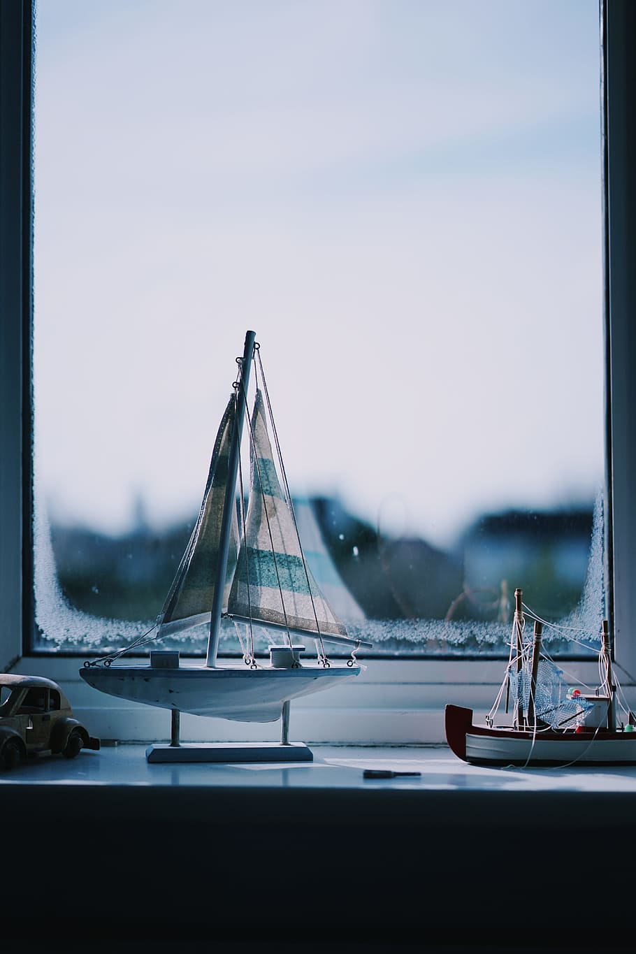 two boat beside window, sailing boat scale model near window HD wallpaper