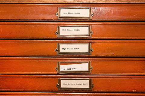 brown-and-white tags on red board, typecases, letters, lead set HD wallpaper