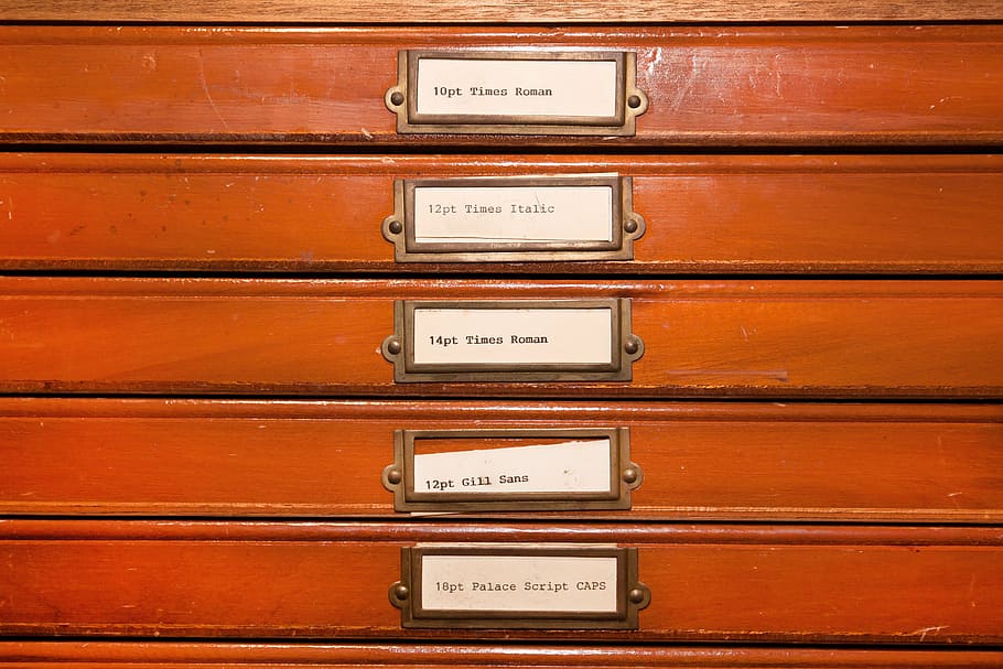brown-and-white tags on red board, typecases, letters, lead set HD wallpaper
