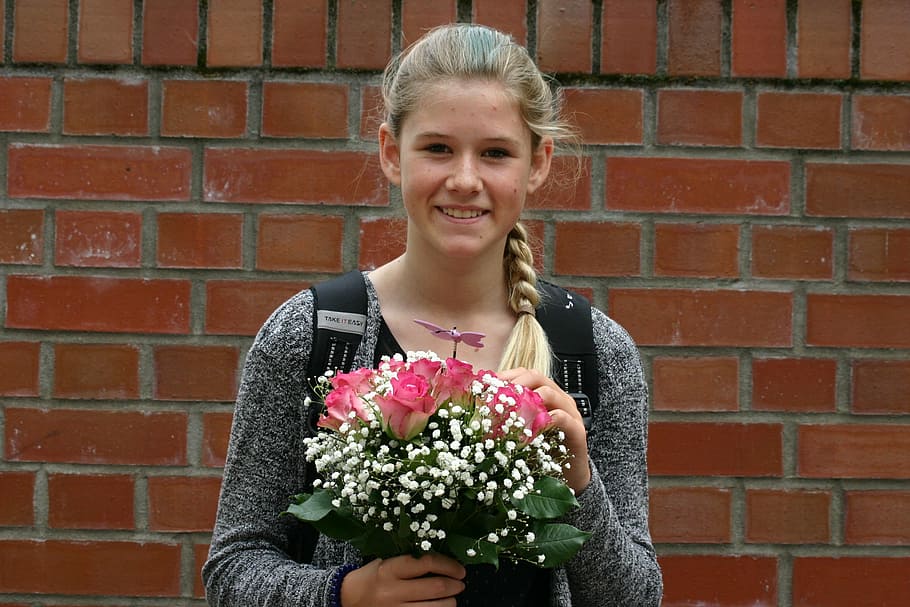 woman holding bouquet of pink roses smiling, brick, wall, portrait HD wallpaper
