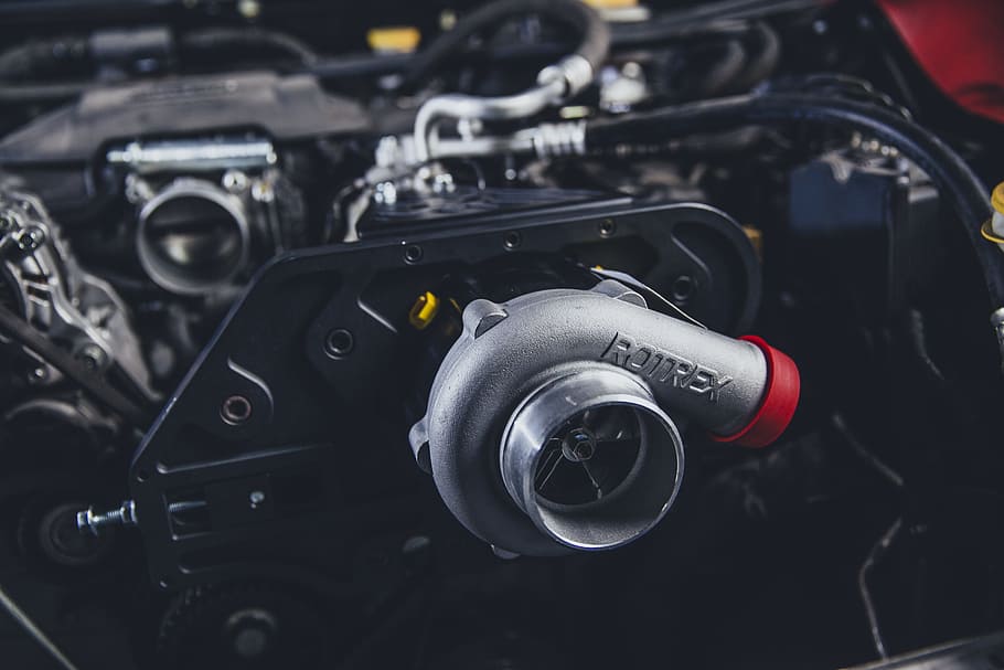 selective focus photography of gray Rotrex turbocharger, engine