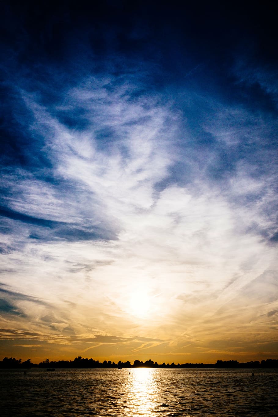 silhouette photography of land near sea under white clouds HD wallpaper