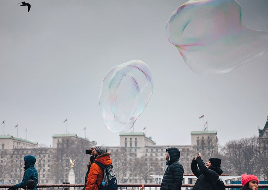 group of people in bubble jackets under gray sky, bubbles, camera HD wallpaper