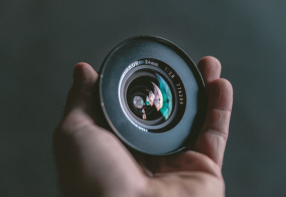 person holding black camera lens, NIKOR, photography, hand, 24mm len HD wallpaper