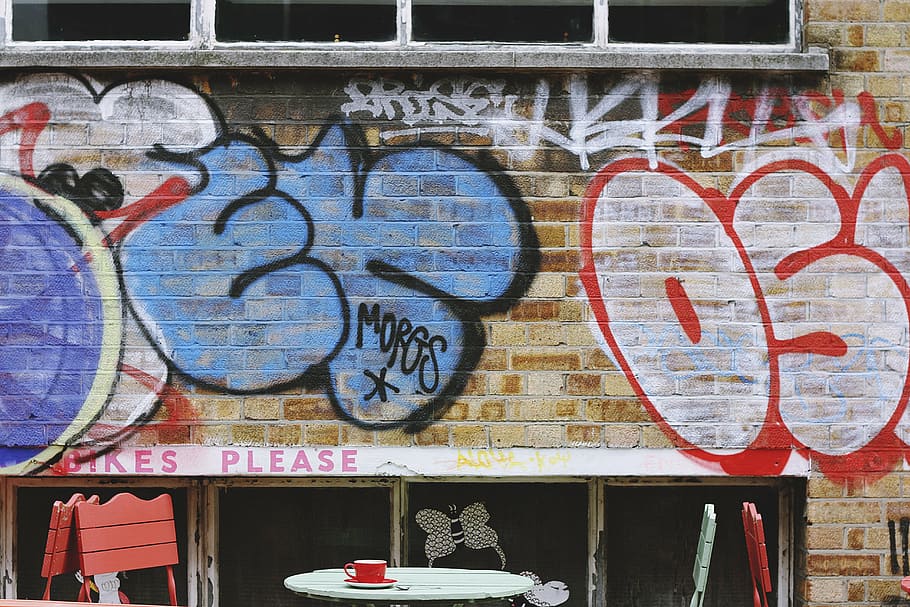 graffiti wall, bricks, paint, vandal, art, letters, table, chairs HD wallpaper