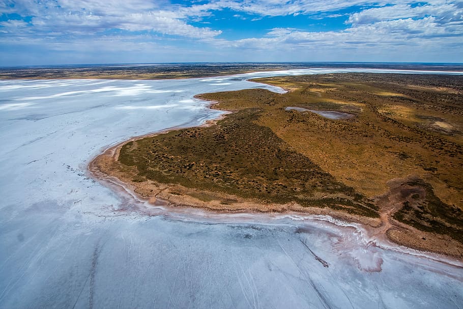 bird's eye view photography of an islet, aerial photo of land near body of water HD wallpaper
