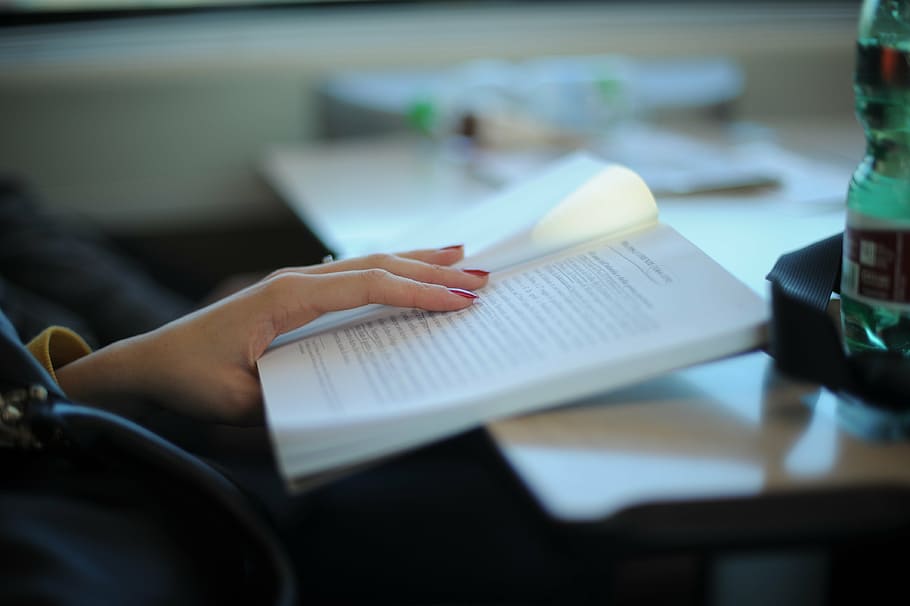 person's hand holding opened black print white book, books HD wallpaper