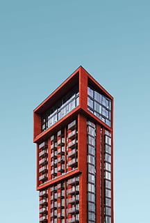 red high rise building, red concrete framed clear glass high-rise building HD wallpaper