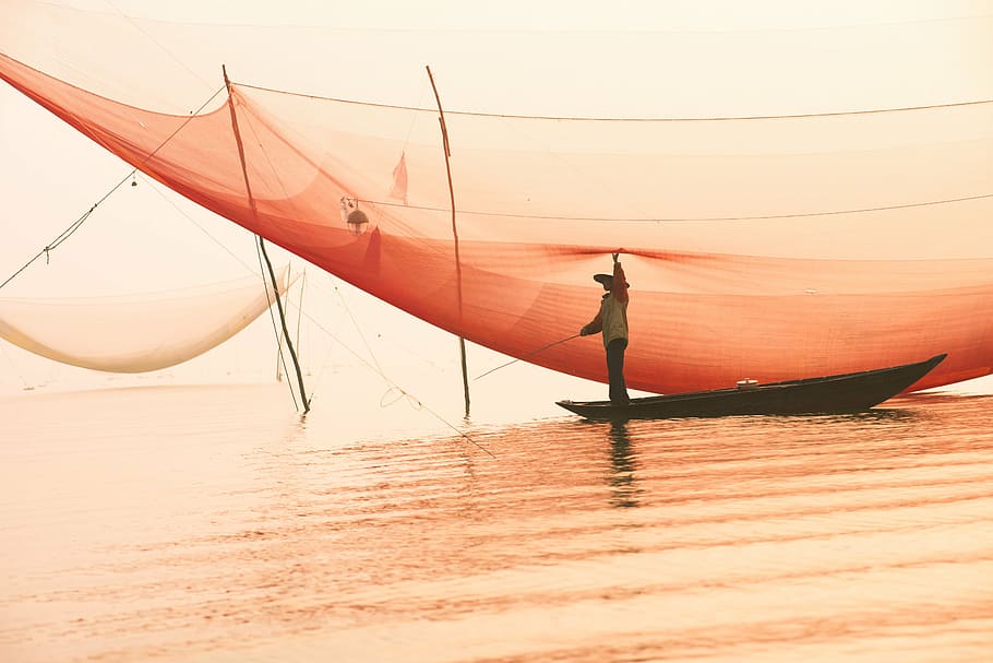 person riding on brown boat, fisherman, landscape, mar, nautical Vessel HD wallpaper