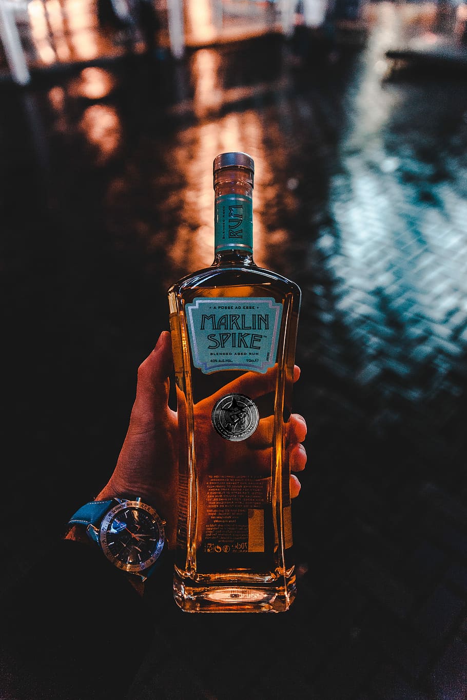 person holding Marlin Spike bottle, person holding Marline Spike whiskey bottle HD wallpaper