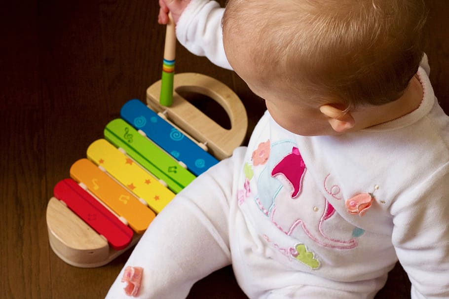 HD wallpaper: baby playing multicolored xylophone toy, baby playing ...